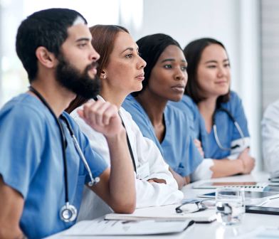 Photograph of nurses in a classroom.