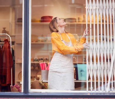 Store owner opening their shop.