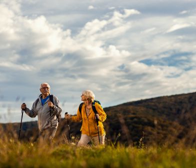 A picture of a retired couple hiking.